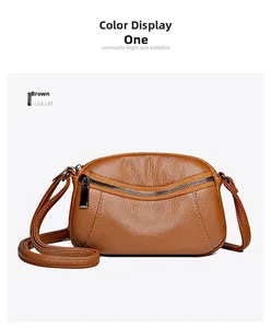 Detailed view of brown lychee texture small crossbody bag with front zipper pocket