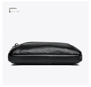 Detailed bottom view showing durable black lychee grain leather and precise stitching