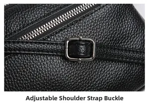 Detail of black lychee grain leather bag with silver zipper and adjustable strap buckle