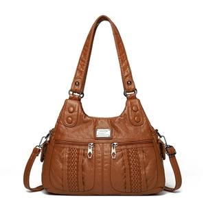 Brown soft pleated leather crossbody bag with woven details and double zipper pockets