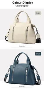 Detail of soft pebbled leather tote featuring dual zippers and woven geometric shoulder strap