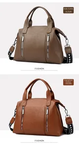 Detail of large tote bag with lychee grain texture and patterned wide shoulder strap