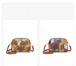 Close-up of geometric color-block leather crossbody bags in grey-brown and blue-brown