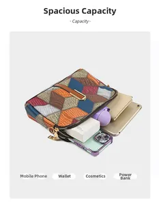 Top view of geometric patchwork crossbody bag interior holding phone and cosmetics