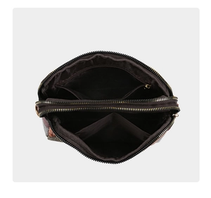 Internal view of the multi-layer crossbody bag showing dual zippers and compartments