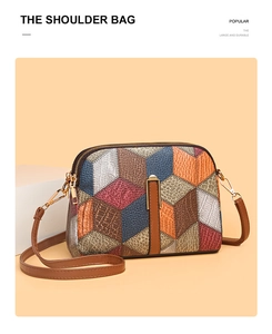 Detail showing geometric patchwork leather pattern and golden hardware on shoulder bag