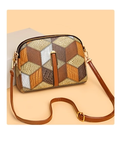 Detail of color-block crossbody bag featuring mixed ostrich and crocodile faux leather textures