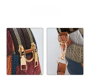 Detail of color-block patchwork leather bag with golden zippers and croc-embossed texture