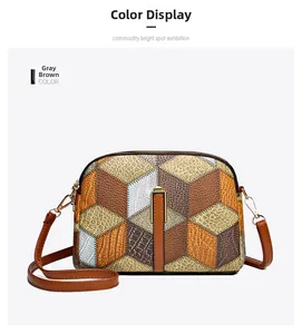 Detail of grey-brown patchwork crossbody bag with lychee and crocodile texture