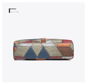 Detail view of the colorful patchwork handbag bottom featuring pebbled texture and neat stitching