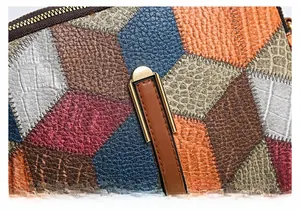 Detail of multi-color patchwork leather bag showing lychee and crocodile textures