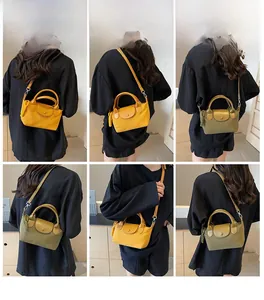 Detailed view of yellow and olive nylon mini crossbody bags shown on a model's shoulder