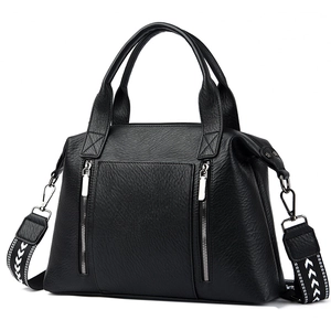 Large black pebbled leather tote bag with dual zippers and chevron patterned strap