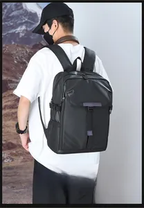 Detail of a lightweight black business backpack featuring breathable mesh side pockets and straps