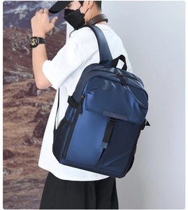 Detail view of large capacity navy blue waterproof nylon business backpack for men