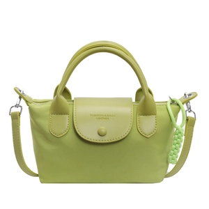 Avocado green nylon crossbody dumpling bag with leather trim and matching charm