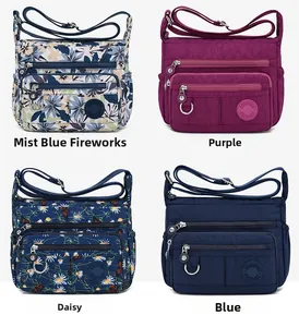 Waterproof nylon crossbody bags shown in various floral prints and solid purple colors