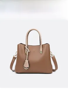 Brown litchi grain leather tote bag with crocodile texture handles and gold hardware