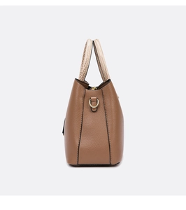 Detail of lychee pattern brown leather tote with cream crocodile texture handles