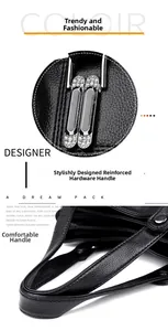 Detail of black leather handbag featuring reinforced strap and rhinestone silver hardware