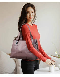 Detail view of large mauve PU leather tote bag with elegant grid stitching and lychee grain