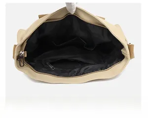 Interior view of canvas travel bag featuring multiple patch pockets and zipper compartment