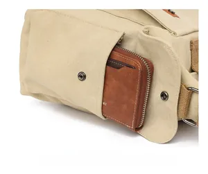 Detail of hidden anti-theft back pocket on canvas travel bag with zip closure