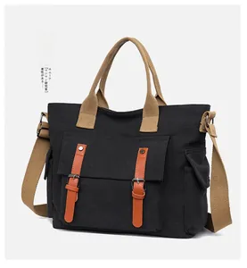 Detail of vintage canvas crossbody bag with brown leather buckles and khaki straps