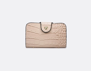 Detail view of light pink crocodile pattern wallet with a golden metal snap closure