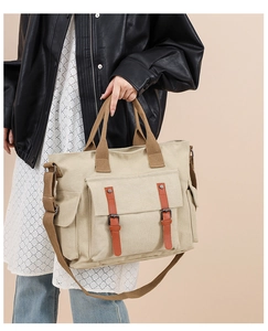 Detail of vintage canvas tote bag showing large capacity and adjustable shoulder strap