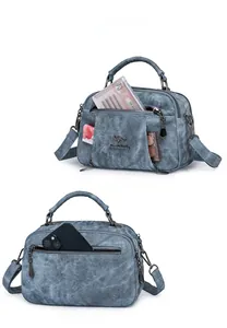Blue-grey washed texture handbag featuring multiple zippered pockets and metal chain charm