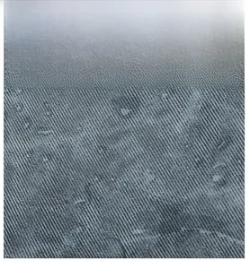 Macro shot of durable grey twill fabric texture on a stylish women's messenger bag
