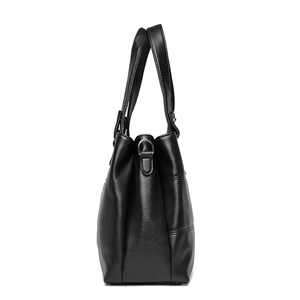 Side view of black lychee grain PU leather shoulder bag with metallic D-ring and dual handles