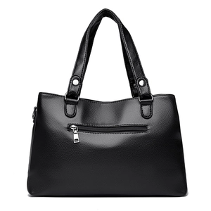 Minimalist black PU leather tote bag with large capacity and grainy texture details