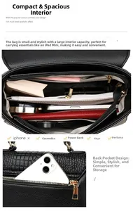 Detailed view of black textured leather bag interior compartments and back zipper pocket