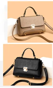 Detail showing crocodile texture flap and litchi grain body on khaki and black handbags