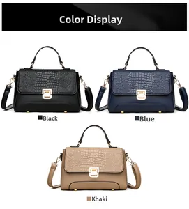 Three elegant handbags in black, blue, and khaki showing crocodile texture and gold hardware