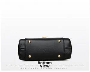 Detail view of the black lychee pattern leather bag bottom with four gold metal feet studs