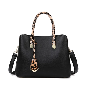 Black pebbled leather tote bag with stylish leopard print handles and gold hardware