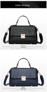 Detail view of crocodile pattern leather handbags in black and blue with gold metal buckles