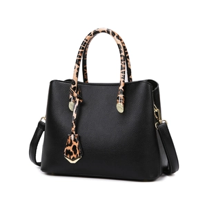 Black pebbled leather tote bag with leopard print handles and golden hardware details