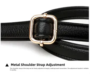 Detail of black pebbled leather shoulder strap with adjustable gold buckle hardware
