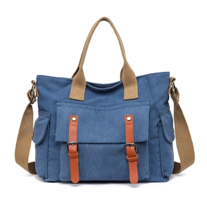 Blue canvas large capacity tote bag with brown straps and vintage metal buckles
