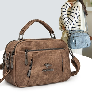 Vintage brown textured leather handbag with multiple zippers and kangaroo logo detail