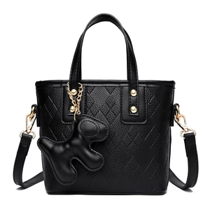 Chic black litchi grain leather bucket bag with V-shaped stitching and puppy charm