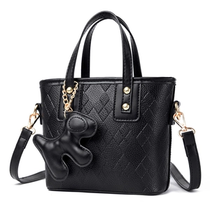 Litchi pattern black bucket bag with diamond texture and cute animal charm accessory