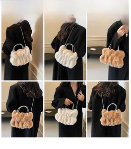Detail showing plush faux fur texture and pearl handle on pleated crossbody bag