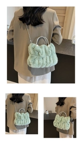 Detail of mint green faux fur bag with rhinestone handle, pearl accents and silver chain