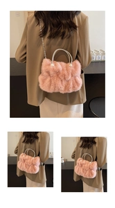 Pink faux fur handbag featuring rhinestone-studded handles and elegant pearl accents