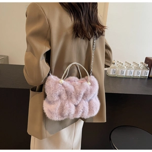 Detail of lavender faux fur cloud bag with pearl accents and sparkling diamond handles